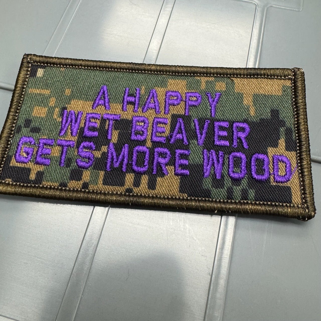 As Seen on Socials - A Happy Wet Beaver Gets More Wood - 2x4 Patch - Marpat Woodland w/Purple