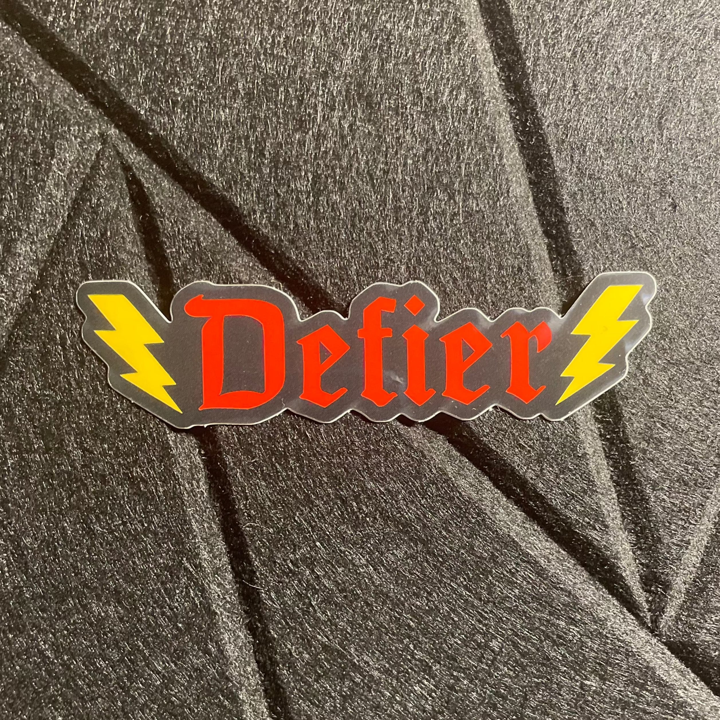 Pegatina de vinilo Defier