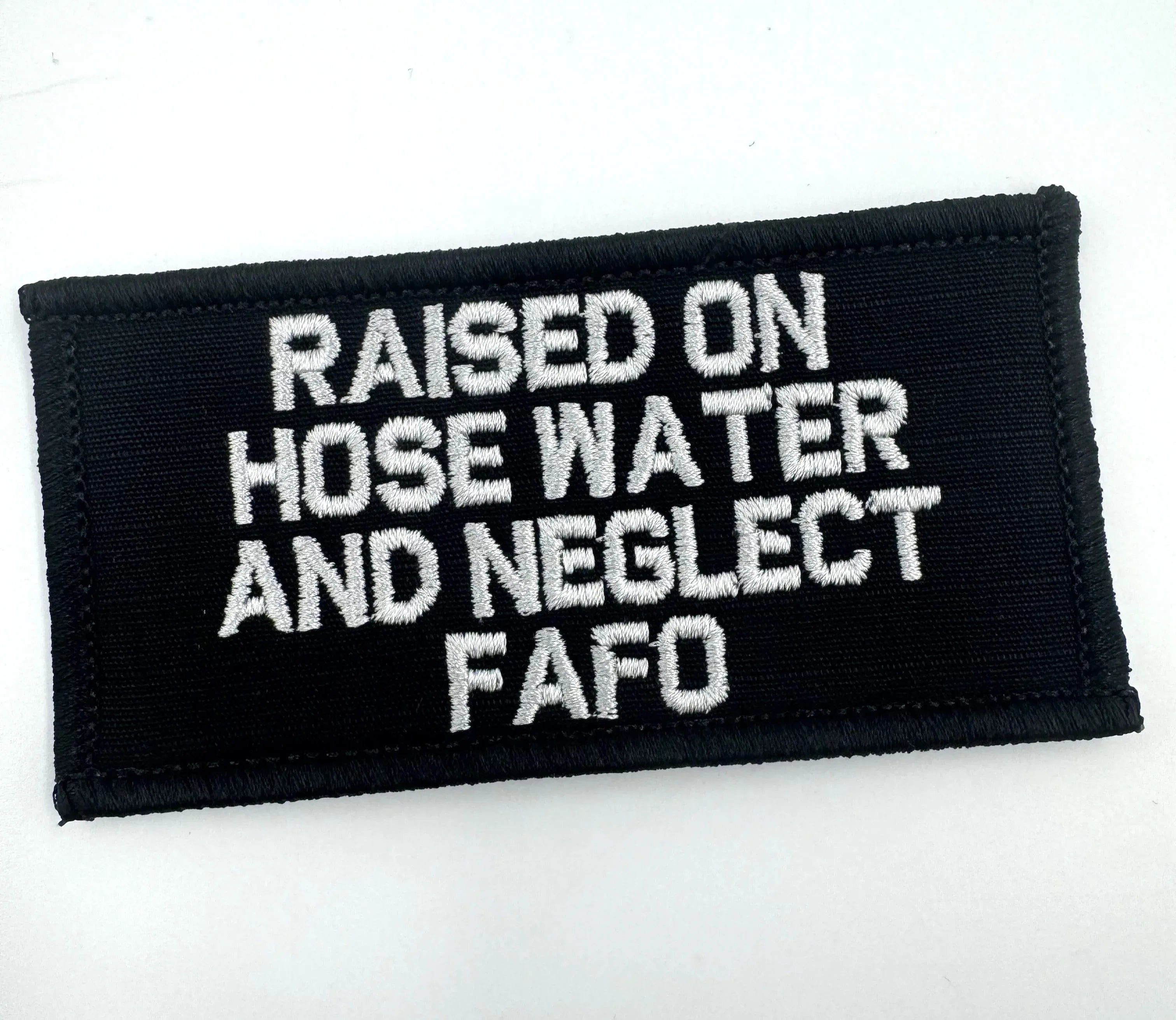 “RAISED ON HOSE WATER AND NEGLECT FAFO” TACTICAL MORALE PATCH
