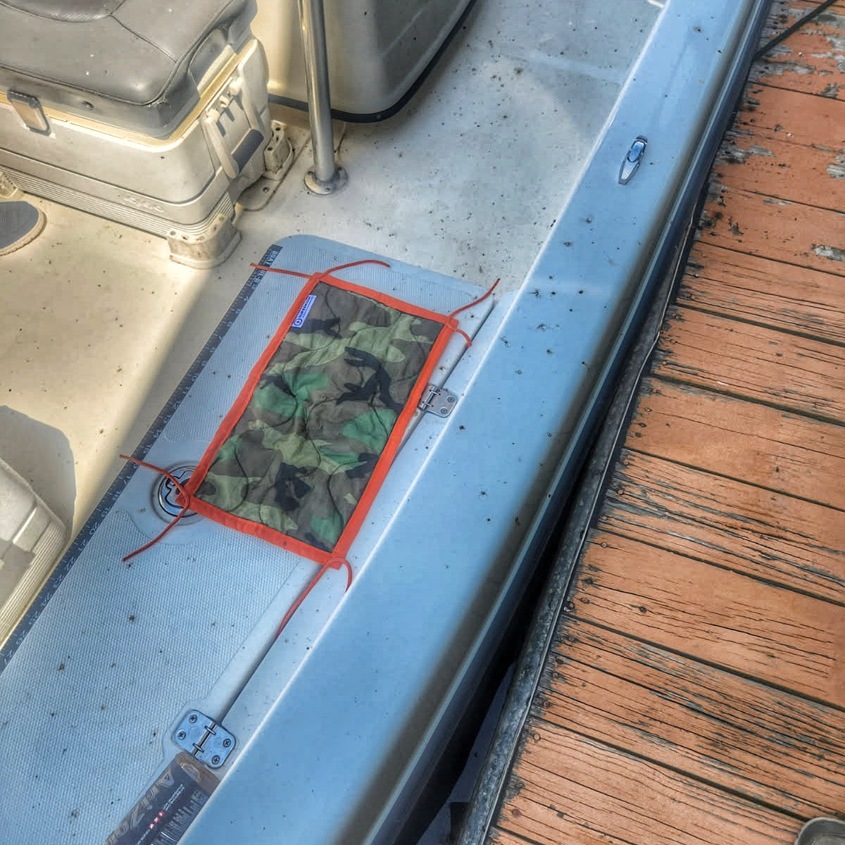 Woobie Hank: Insulated with USGI poncho-liner, serves as a large rag, knee pad, and adventure companion tool.