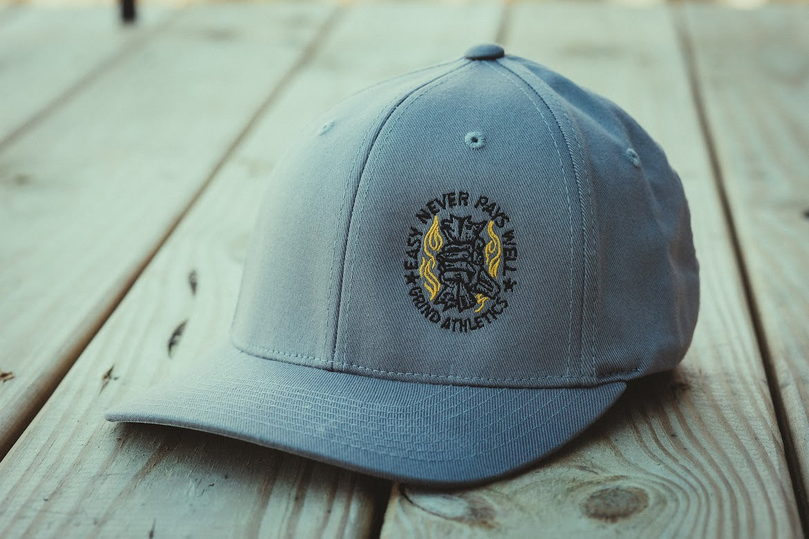 Easy Never Pays Well Flexfit Hats - Embroidered